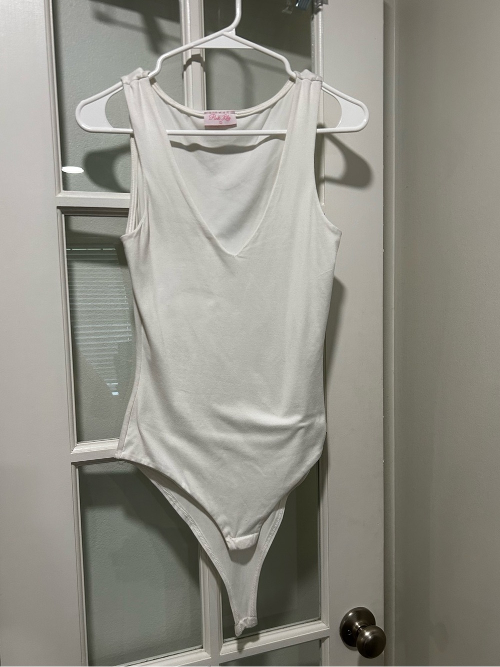 Pink Lily White Sleeveless V-Neck Bodysuit
